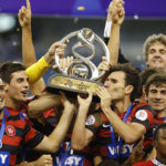 Players of Australia’s Western Sydney Wanderers hold trophy as celebrate winning second-leg soccer match of Asian Champions League final against Saudi Arabia’s Al Hilal at King Fahd International Stadium in Riyadh